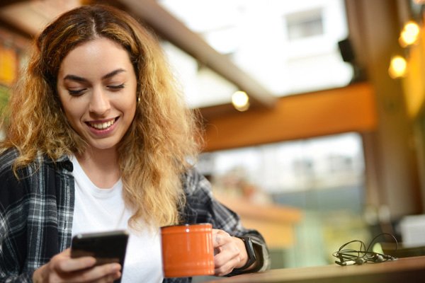 Woman contacting her bank customer service via whatsapp